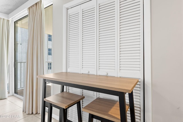 dining area featuring light tile patterned floors