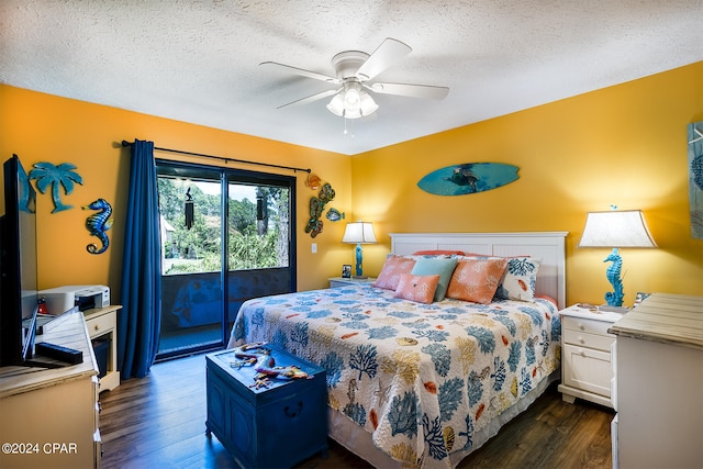 bedroom featuring access to exterior, a textured ceiling, and dark hardwood / wood-style floors