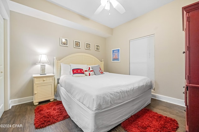 bedroom featuring dark hardwood / wood-style floors and ceiling fan