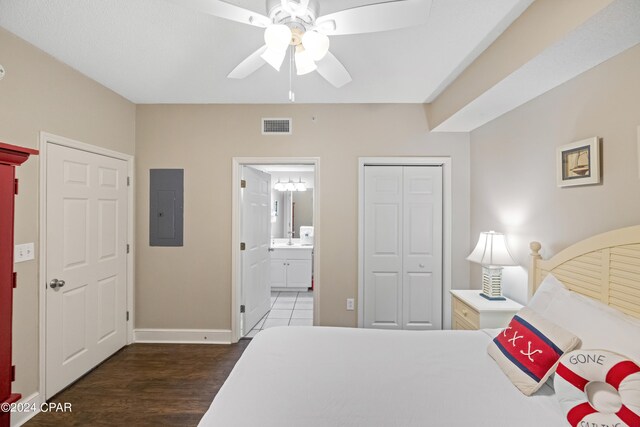 bedroom with sink, connected bathroom, ceiling fan, and dark hardwood / wood-style floors