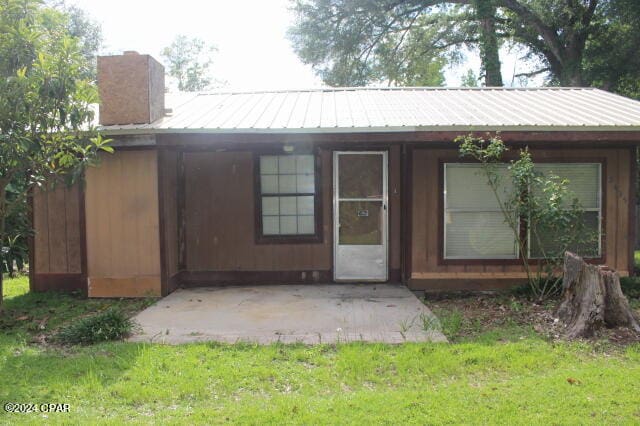 exterior space with a lawn