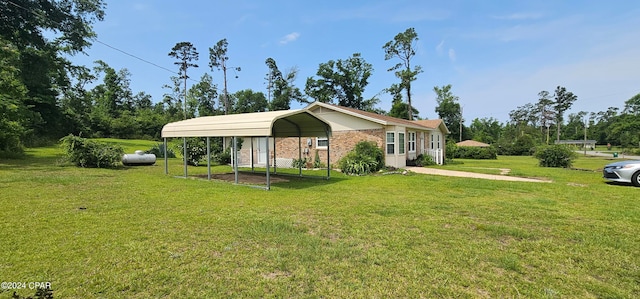 single story home with a front yard and a carport