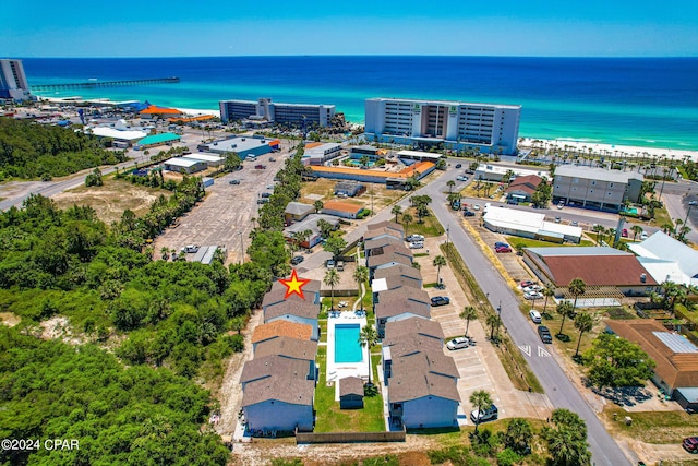 drone / aerial view featuring a view of the beach and a water view