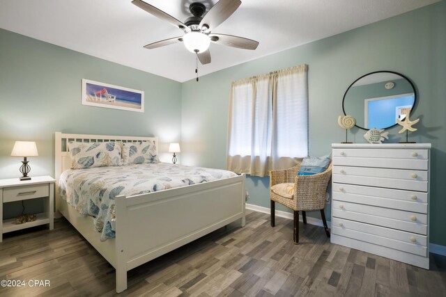 bedroom with hardwood / wood-style flooring and ceiling fan