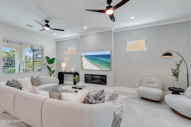 living room with ceiling fan and ornamental molding