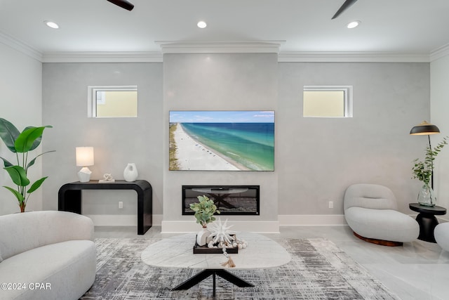 living room featuring ornamental molding and ceiling fan