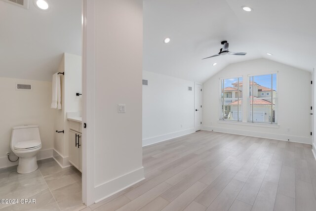 bathroom with vanity, hardwood / wood-style floors, toilet, lofted ceiling, and ceiling fan