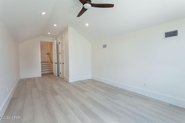 interior space featuring vaulted ceiling, light wood-type flooring, and ceiling fan