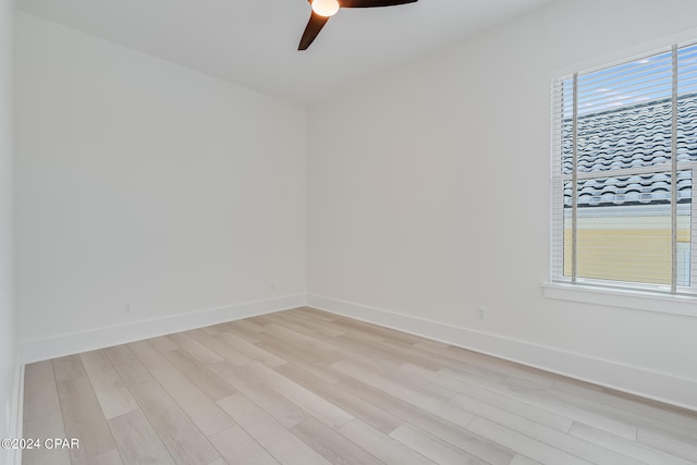 unfurnished room with ceiling fan and light hardwood / wood-style floors