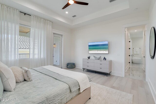 walk in closet with light hardwood / wood-style flooring