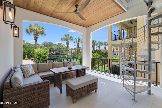 view of patio featuring ceiling fan, an outdoor hangout area, and a balcony