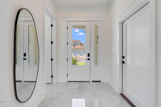 doorway to outside with ornamental molding