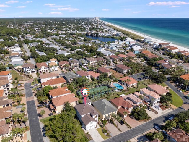 birds eye view of property featuring a water view and a view of the beach