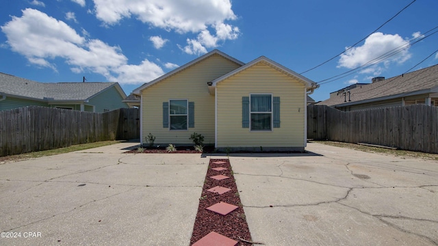 rear view of property featuring a patio