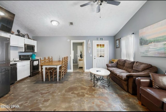 living room with a textured ceiling, ceiling fan, and lofted ceiling