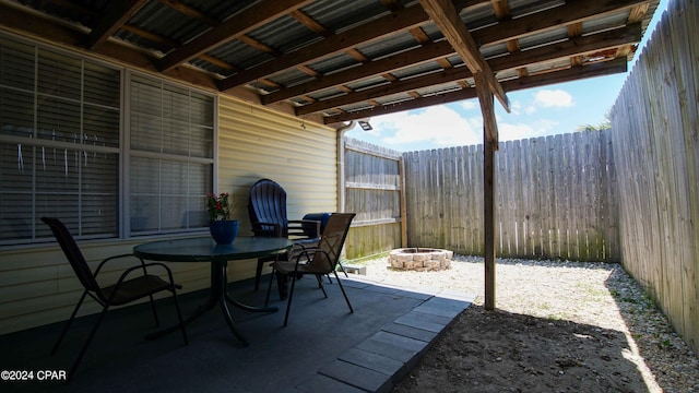 view of patio with a fire pit