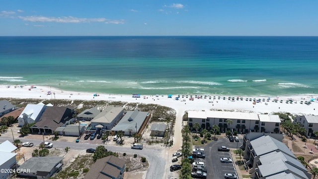 birds eye view of property featuring a view of the beach and a water view