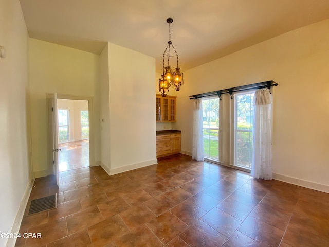 empty room with a chandelier