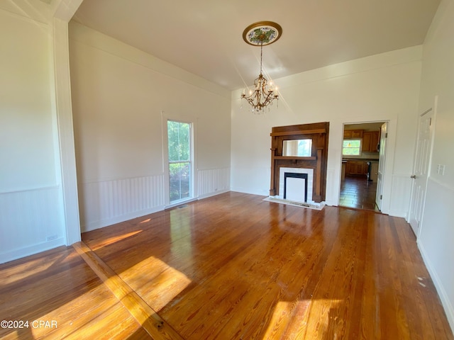 interior space featuring hardwood / wood-style flooring and a notable chandelier