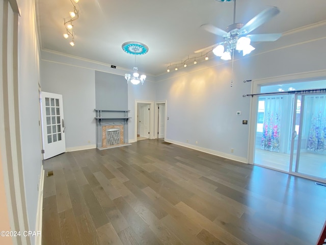 unfurnished living room with ceiling fan with notable chandelier, ornamental molding, wood-type flooring, and a high end fireplace