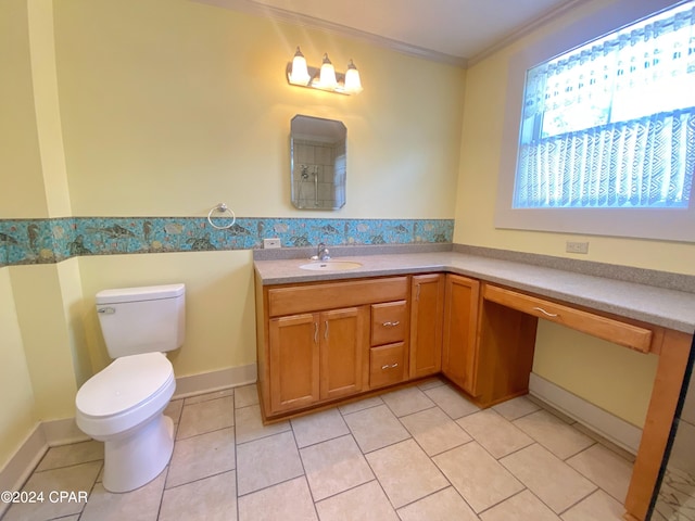 bathroom with tile patterned floors, toilet, crown molding, and vanity