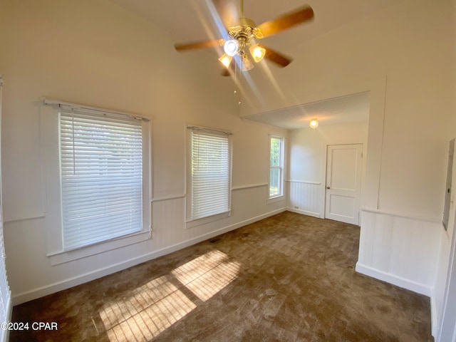 unfurnished room featuring lofted ceiling, carpet, and ceiling fan