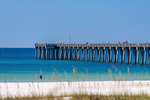 water view with a pier and a view of the beach