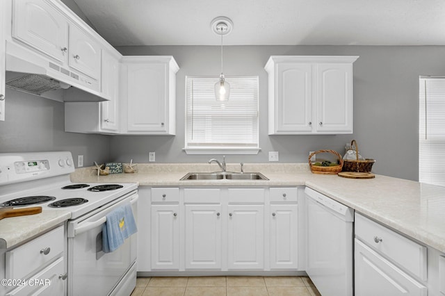 kitchen featuring white cabinetry, white appliances, under cabinet range hood, and a sink