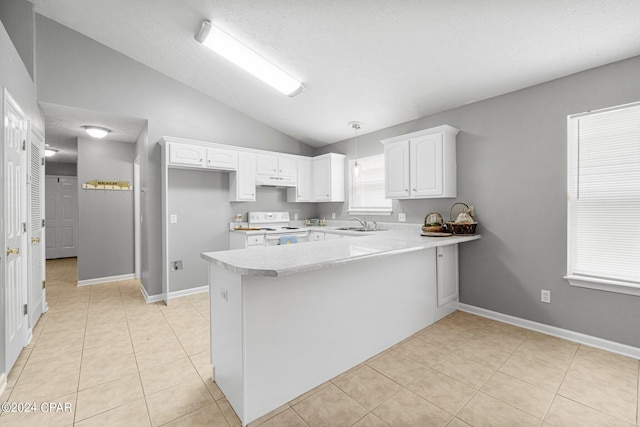 kitchen featuring white electric range oven, a peninsula, white cabinets, light countertops, and vaulted ceiling