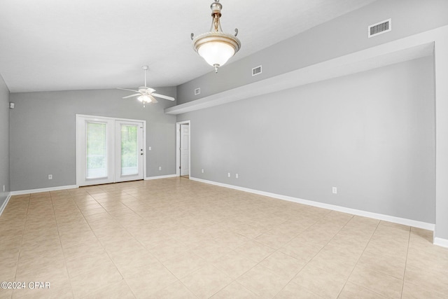 spare room with visible vents, a ceiling fan, baseboards, and vaulted ceiling