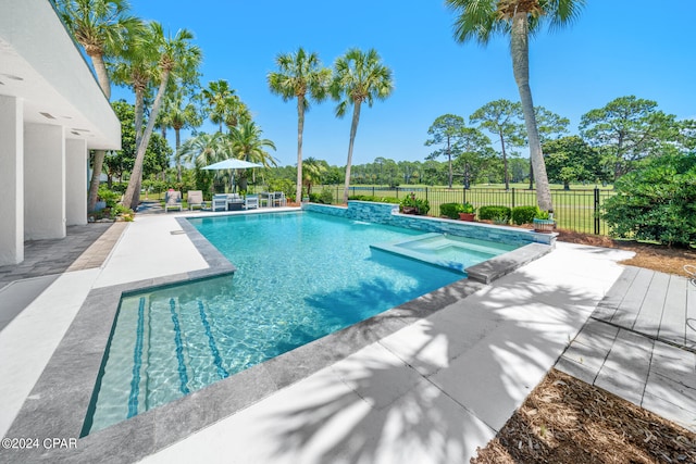 view of pool featuring an in ground hot tub and a patio area