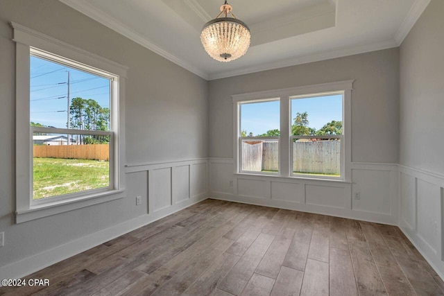 unfurnished room featuring a wealth of natural light and light hardwood / wood-style flooring