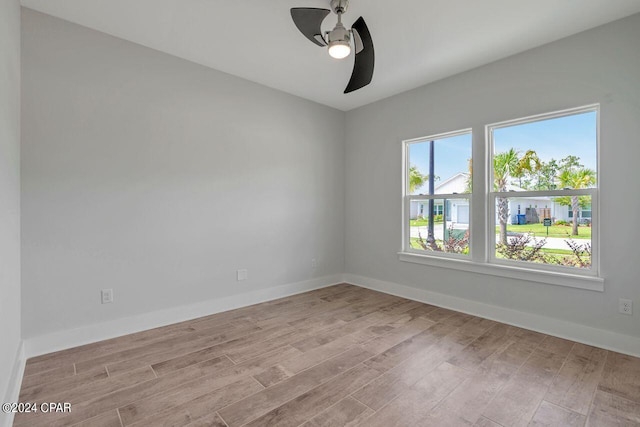 unfurnished room with light hardwood / wood-style flooring and ceiling fan