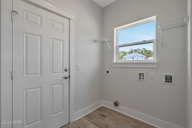 laundry area featuring hookup for an electric dryer, washer hookup, and light hardwood / wood-style flooring