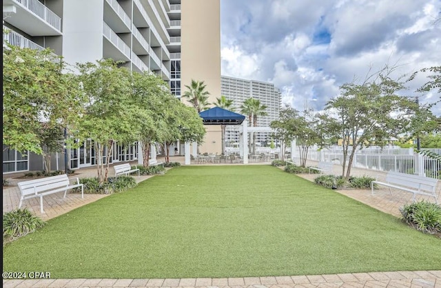 9860 S Thomas Dr Unit 519, Panama City, FL 32408 - surrounding community with a lawn and fence