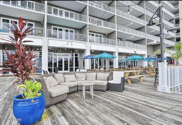 9860 S Thomas Dr Unit 519, Panama City, FL 32408 - wooden terrace with an outdoor hangout area