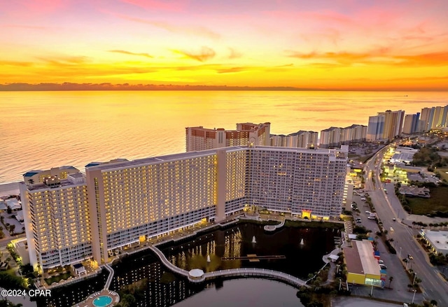 9860 S Thomas Dr Unit 519, Panama City, FL 32408 - aerial view at dusk featuring a water view and a city view