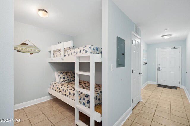 9860 S Thomas Dr Unit 519, Panama City, FL 32408 - bedroom featuring light tile patterned floors, baseboards, and electric panel