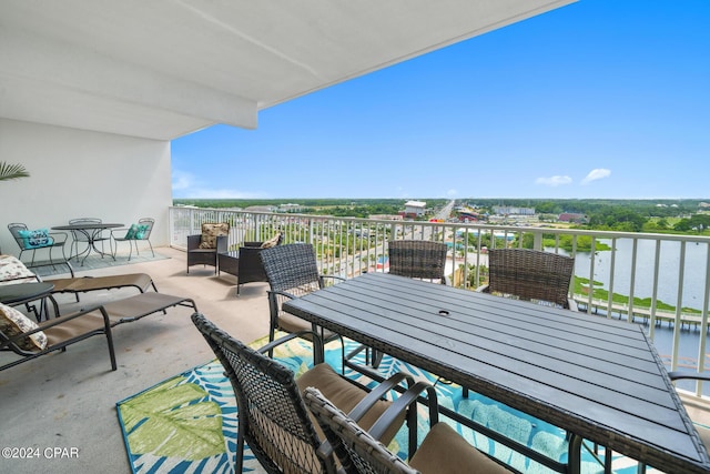 balcony featuring a water view