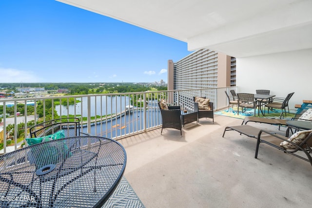 balcony featuring a water view