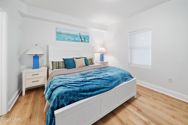 bedroom with light hardwood / wood-style floors