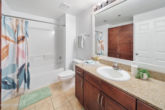 full bathroom featuring tile patterned flooring, vanity, shower / bath combo, and toilet