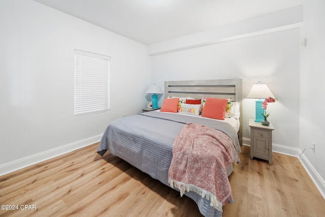 bedroom with light hardwood / wood-style flooring