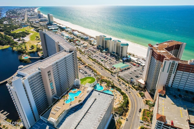 drone / aerial view with a water view and a view of the beach