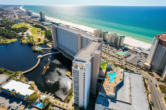 drone / aerial view with a water view and a beach view