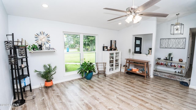 sitting room featuring light wood-type flooring, ceiling fan, and lofted ceiling