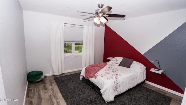 bedroom featuring wood-type flooring and ceiling fan