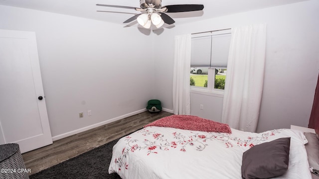 bedroom featuring dark hardwood / wood-style flooring and ceiling fan