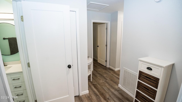 hallway featuring dark hardwood / wood-style flooring