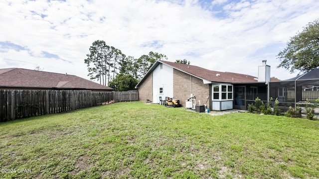 view of yard featuring a sunroom